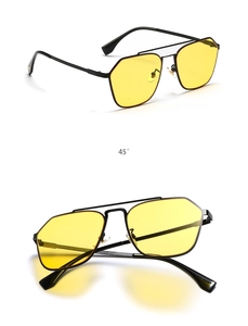 Close-up of double bridge pilot sunglasses with matte black frame and yellow lenses