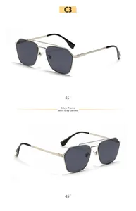 Detail of silver double bridge aviator sunglasses with gray lenses and golden triangle trim