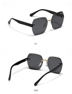 Detail view of rimless polygon sunglasses with gradient lenses and gold metal bridge