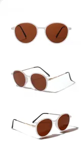 Detail view of round vintage sunglasses with gold metal temples and CE mark engravings