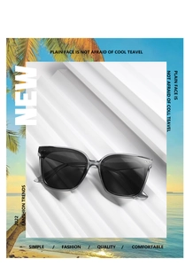 Detail of square beige sunglasses featuring silver bar rivets and dark polarized lenses