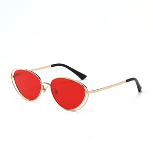Retro metal punk cat eye sunglasses with red lenses and gold frame in a 45-degree side view