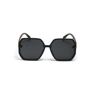 Modern oversized hexagonal black sunglasses with sleek gold metal accent on the frame