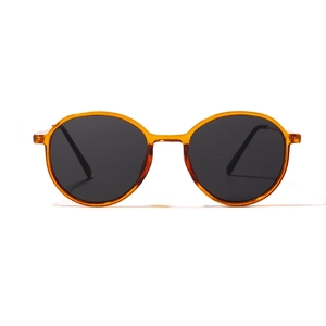 Vintage round amber resin sunglasses with dark lenses shown on a clean white background