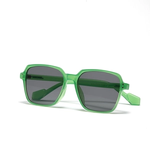 Modern oversized square sunglasses with translucent green frames and grey lenses