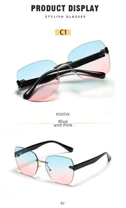 Detail of square rimless sunglasses with blue-pink gradient lenses and gold metal bridge