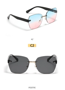 Close-up of square rimless sunglasses with blue-pink gradient and grey lenses