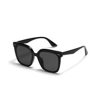 Fashionable beige square sunglasses with black lenses and silver dots on the frame