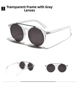 Close-up of retro round sunglasses with transparent frames and dark grey lenses