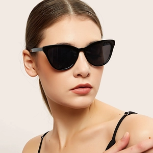 Classic black cat eye sunglasses for women featuring dark lenses and high-quality frames
