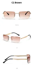 Futuristic rimless sunglasses detail showing gradient brown lenses and gold metal temples