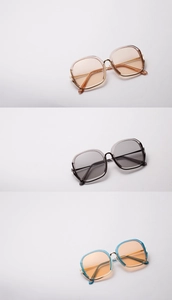 Detailed view of large half-frame sunglasses in coffee, gray, and blue-orange colors