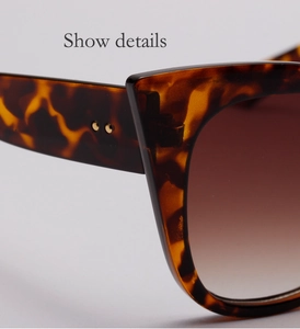 Makro-Detail der Schildpatt-Sonnenbrille mit Metallnieten und Verlaufsgläsern