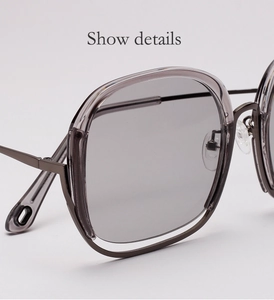 Detail view of transparent purple frame sunglasses with metal hinges and soft nose pads