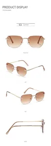 Detail of rimless rectangle sunglasses with brown gradient lenses and gold rope temples