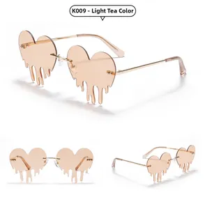 Detail view of dripping heart sunglasses K009 in light tea color with metal frames