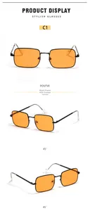 Detail view of square metal sunglasses C1 with black frame and orange transparent lenses