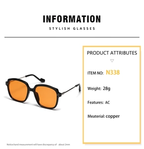 Detail view of square black sunglasses with orange lenses, N338 model, copper temples