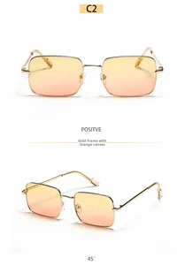 Detailed close-up of golden metal frame square sunglasses with orange gradient lenses