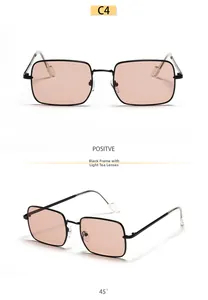 Detail view of square black metal sunglasses with light tea lenses and soft nose pads