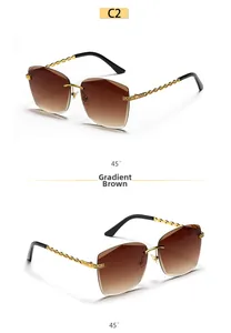 Detail view of gradient brown rimless square sunglasses with gold chain temples at 45° angle