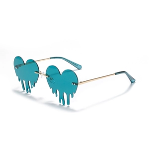Lava heart rimless sunglasses in teal blue with gold metal frame and melting effect