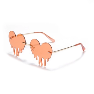 Lava heart rimless sunglasses with orange dripping heart lenses and gold metal temples
