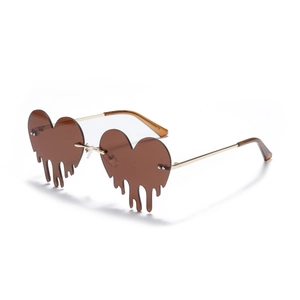 Fashionable rimless heart shaped sunglasses with dripping effect and gold metal temples