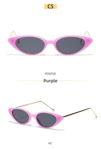 Lunettes de soleil œil-de-chat rose translucide avec branches en métal doré vues de face