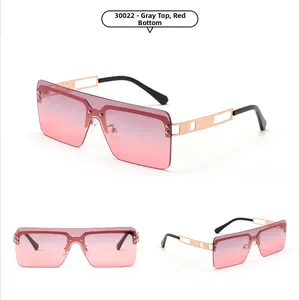 Detailed view of oversized rimless square sunglasses with gradient grey-pink lenses