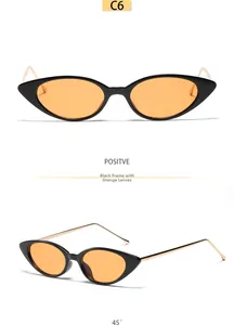 Vue détaillée de lunettes œil de chat avec monture noire et verres orange élégants