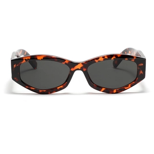 Retro cat-eye tortoiseshell sunglasses with dark gray lenses and chic polygon frame style