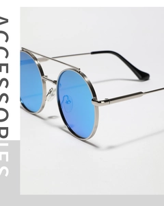 Detail of blue mirrored lenses and silver double-bridge metal frames on retro sunglasses