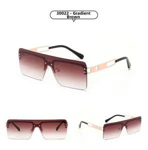 Close-up of rimless square sunglasses with gradient tea lenses and hollow metal temples