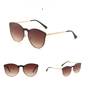 Detailed views of rimless cat-eye sunglasses with gradient brown lenses and gold temples