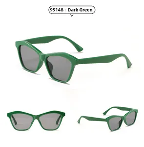 Detailed views of dark green geometric sunglasses with stylish polygonal frames and grey lenses