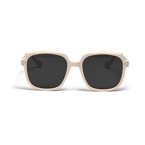 Fashionable square beige sunglasses with dark lenses and metal rivet details