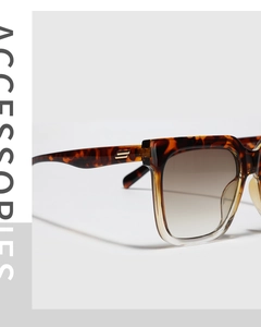 Detail of tortoise square sunglasses with gradient lenses and gold metal accents