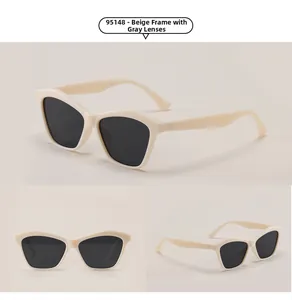 Three-view display of beige cat-eye sunglasses with grey lenses and irregular frame shape