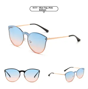 Macro view of cat-eye rimless sunglasses with blue to pink gradient lenses and metal frames