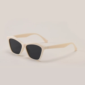 Fashionable cream cat-eye sunglasses for women with dark UV-protective lenses