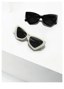 Macro view of geometric cat eye sunglasses SS3933 in black and off-white frames
