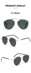 Detail view of gold metal aviator sunglasses with double bridge and black lenses