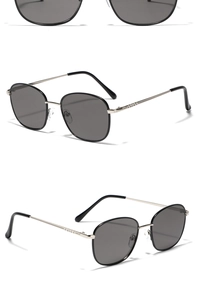 Detail of square metal sunglasses featuring silver frames and engraved textured temples