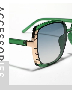 Detailed macro view of green acetate frames with gold metal hinges and gradient lenses