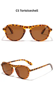 Detail view of C5 Tortoise sunglasses featuring brown lenses and retro leopard frame