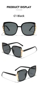 Detail view of large square sunglasses showing gold temple accents and product model 9149