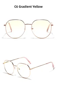 Vue détaillée des lunettes de soleil en métal avec verres jaunes dégradés et embouts roses