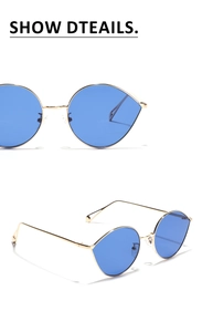 Détails de la monture en métal doré et verres bleus des lunettes de soleil ovales