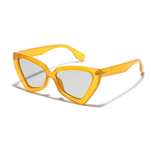 Oversized orange transparent cat-eye sunglasses with gradient grey lenses in a retro Y2K style